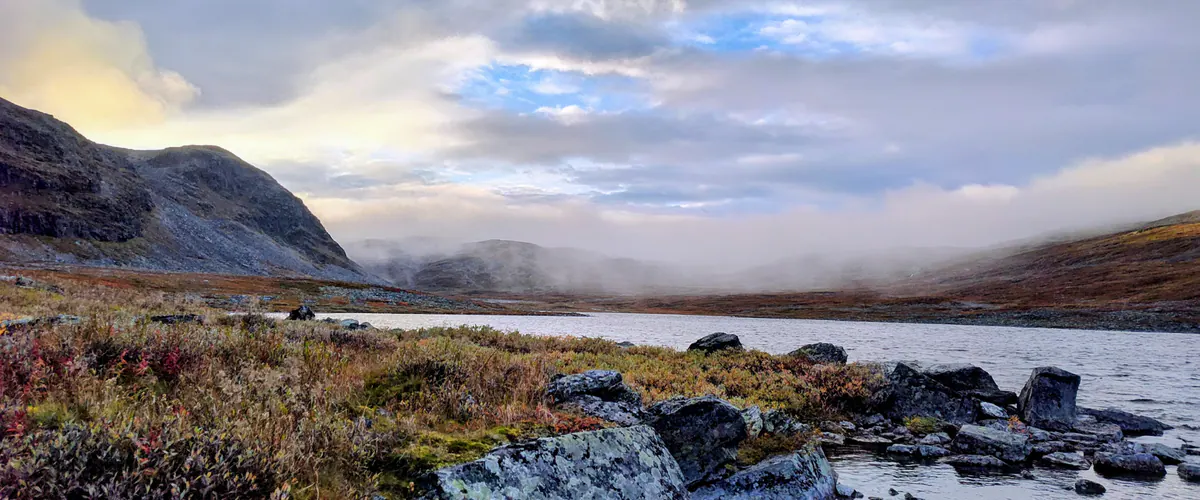 Misty fell lake in Northern Lapland