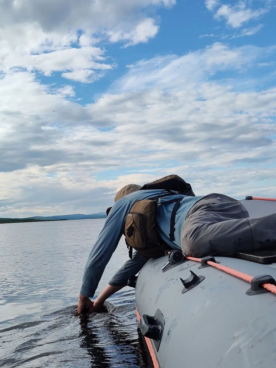 Angler releasing a grayling