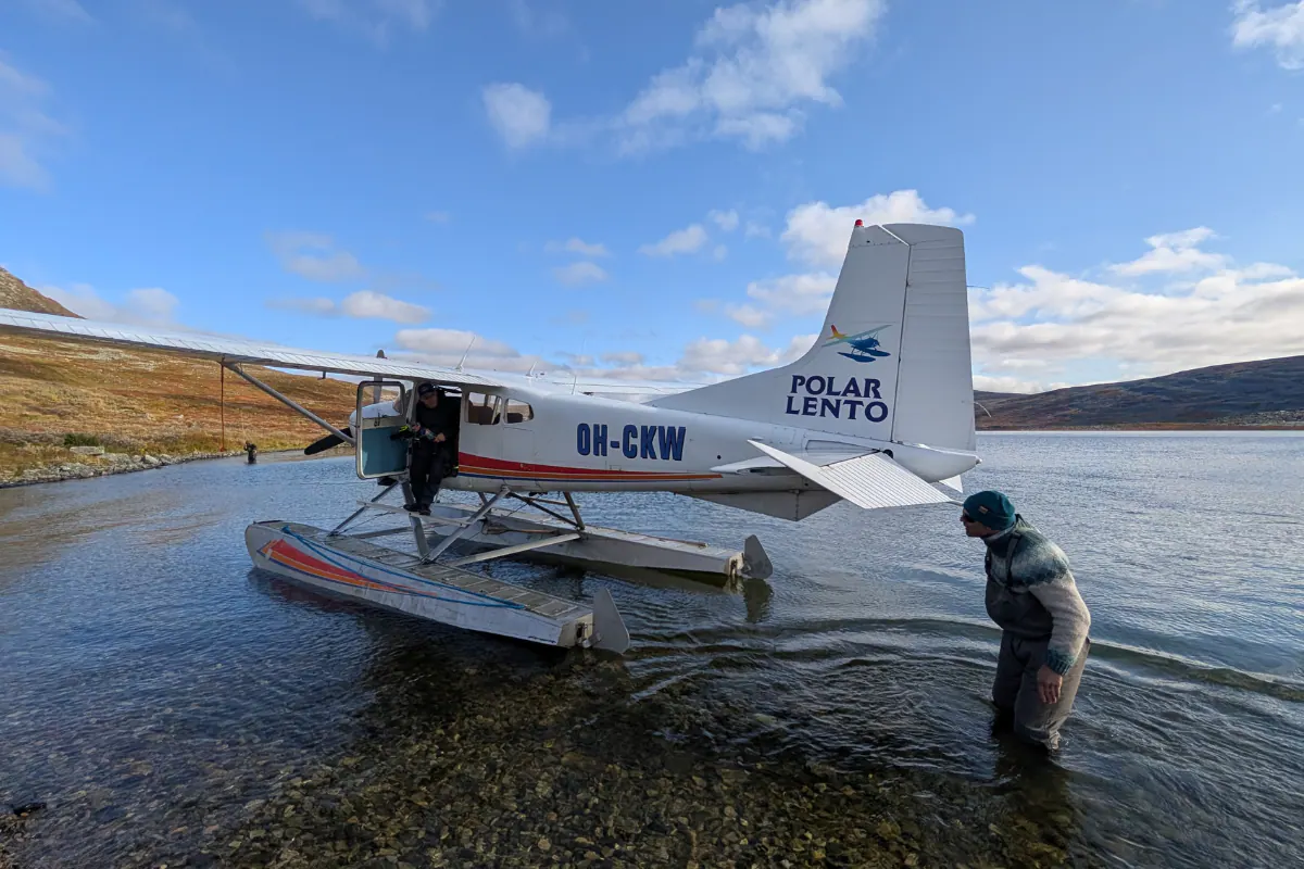 Floatplane at the shore of a wilderness lake