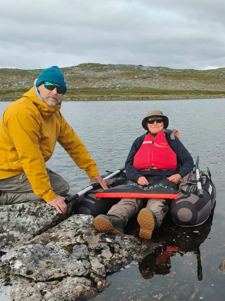Guide with a guest in a packraft on a lake