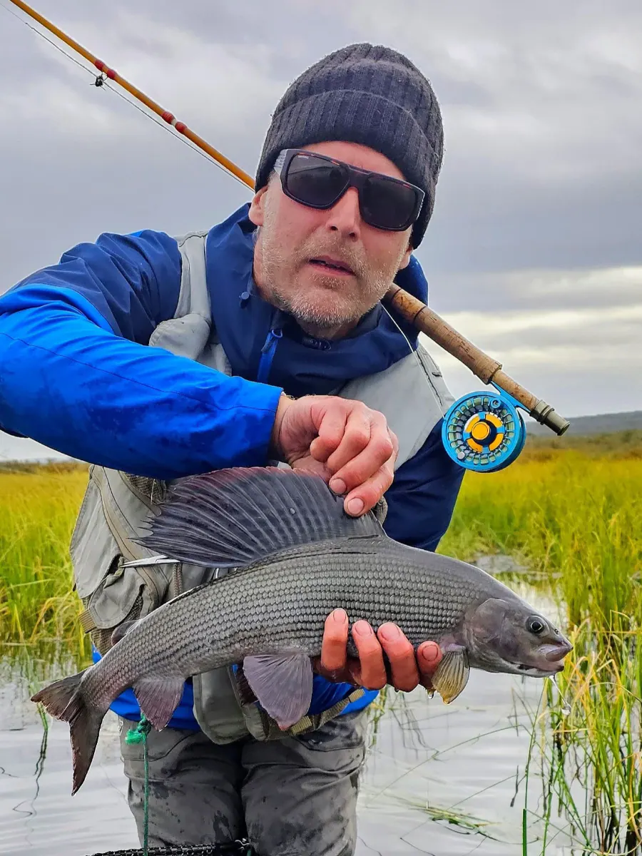 Teemu holding a big grayling