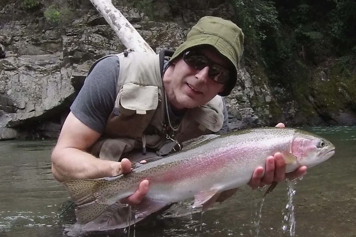 Angler holding a wild rainbow trout