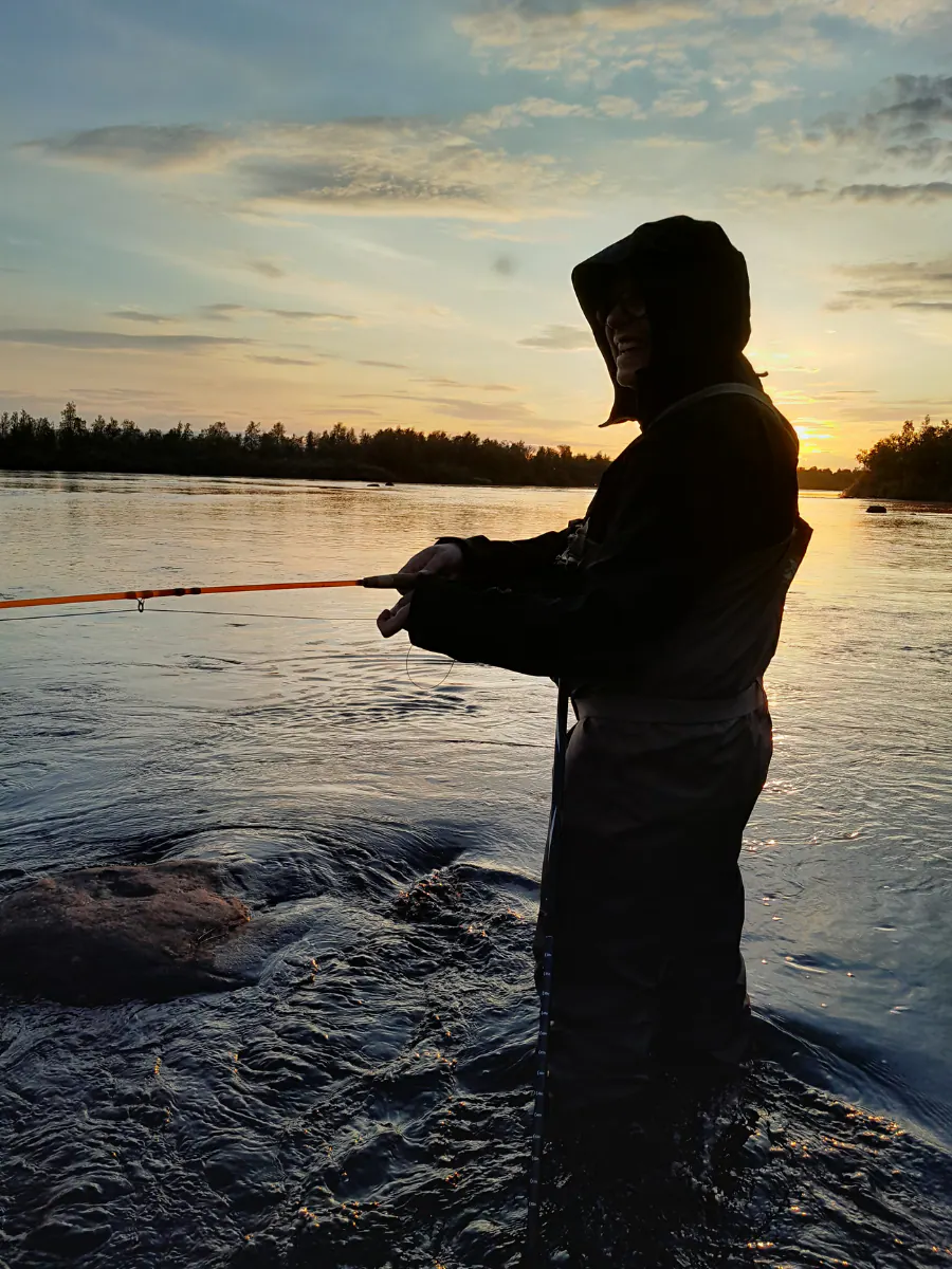 Angler fishing into the sunset