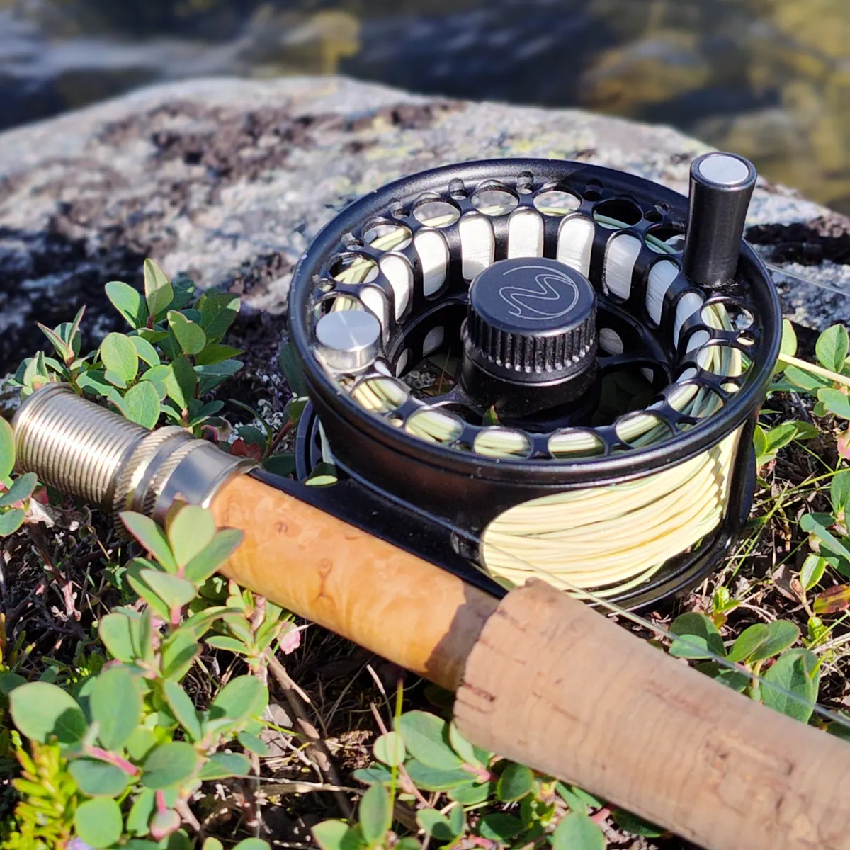 Fly reel and rod on the moss