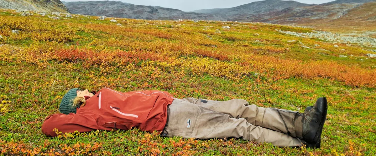Angler resting in the autumn colours of the fells