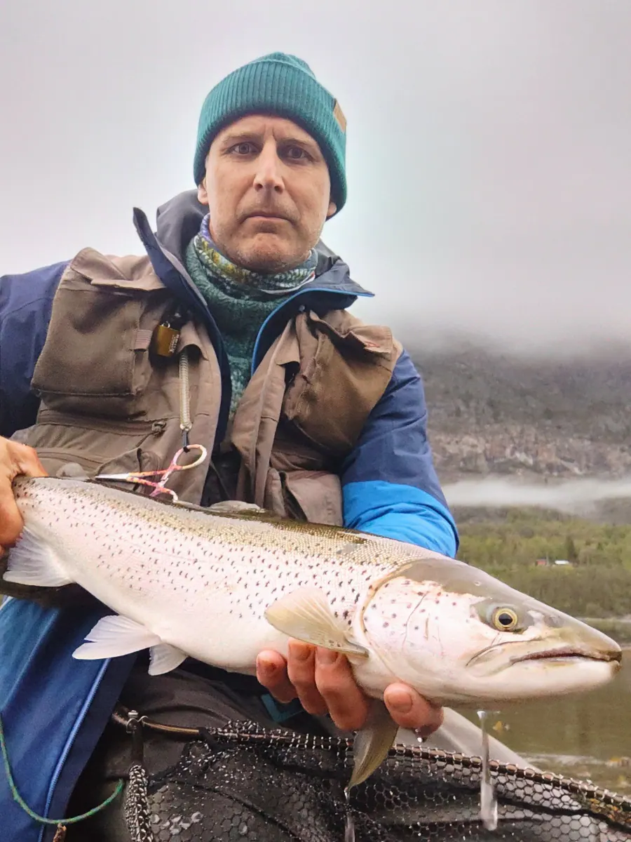 Angler holding a silver sea trout