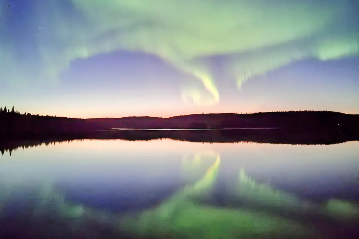 Northern lights reflected in a lake